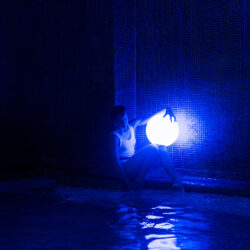 relaxed-young-woman-pool-with-neon-light (1)